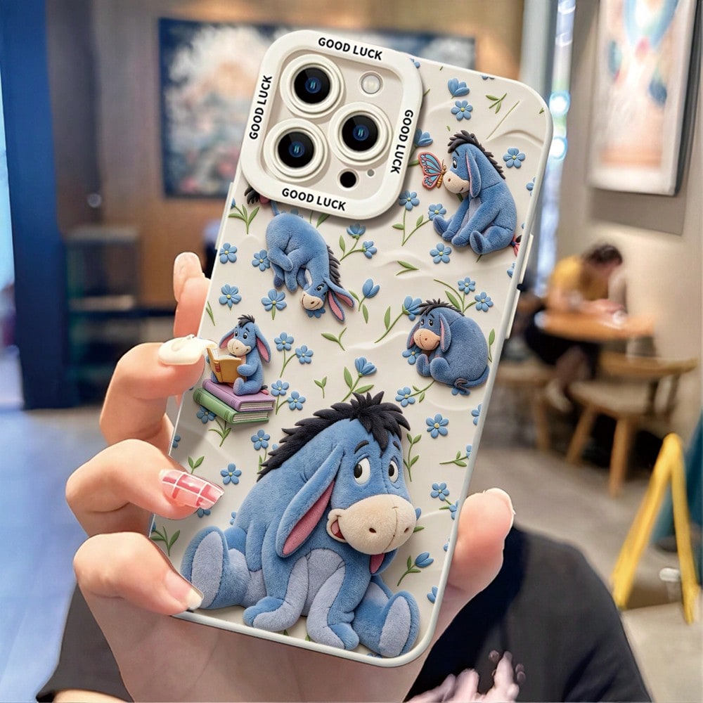 Disney Winnie The Pooh Phone Case, Cute Multi-Pose Eeyore Character Print With Blue Flower, Butterfly & Stacked Book Decor, Off-White Soft Background And "GOOD LUCK" Text On Camera Border, Shockproof