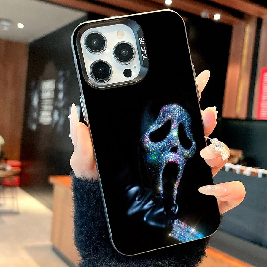 Sparkling Ghost Face Mobile Phone Case Designed With Rhinestones And A Sleek Black Finish Suitable For IPhone 16 15 14 13 12 And 11 Pro Models Made Of TPU Material And Provides Shockproof Protection.