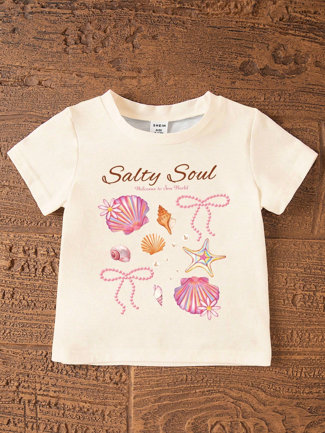 2pcs/Set Cute Baby Girls Beige Summer Outfit,Ocean Creature Shell Bow Print Round Neck T-Shirt And Fitted Bike Shorts,Vacation Holiday Beach Set