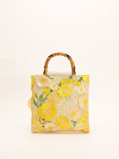 A Summer Style Beige Canvas Tote Bag With Bamboo Handle. This Women's Handbag Combines Linen And Mesh Fabric, Decorated With Exquisite 3D Floral Embroidery, Creating A Bohemian Vibe. It Is The Perfect