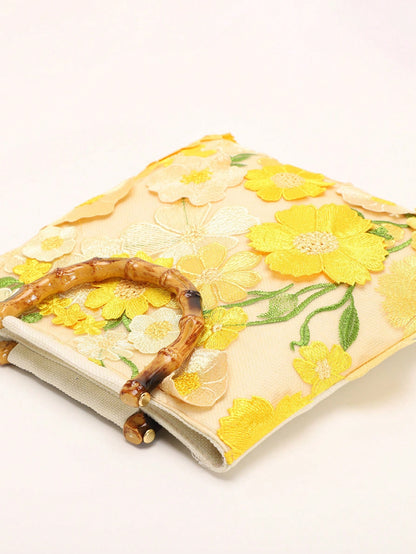 A Summer Style Beige Canvas Tote Bag With Bamboo Handle. This Women's Handbag Combines Linen And Mesh Fabric, Decorated With Exquisite 3D Floral Embroidery, Creating A Bohemian Vibe. It Is The Perfect
