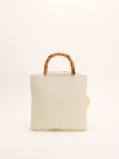 A Summer Style Beige Canvas Tote Bag With Bamboo Handle. This Women's Handbag Combines Linen And Mesh Fabric, Decorated With Exquisite 3D Floral Embroidery, Creating A Bohemian Vibe. It Is The Perfect