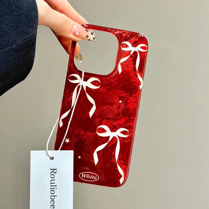 Autumn/Winter Christmas Red Background White Bowknot Glacier Pattern Anti-Fall Protective Phone Case Compatible With Apple 16/ 15 Pro Max/14/13/12