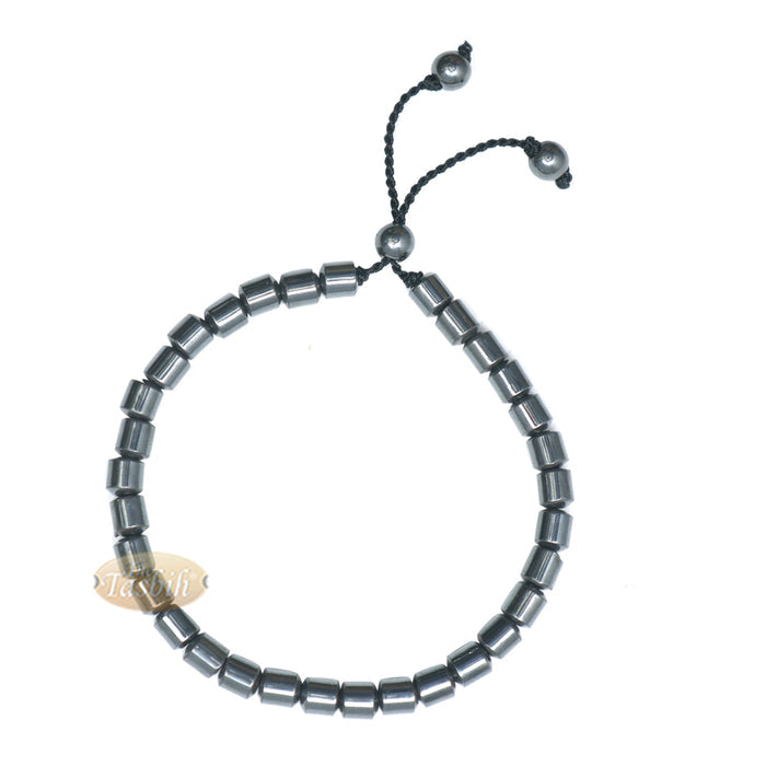 Black cylindrical-bead Islamic tasbih bracelet with adjustable cord.