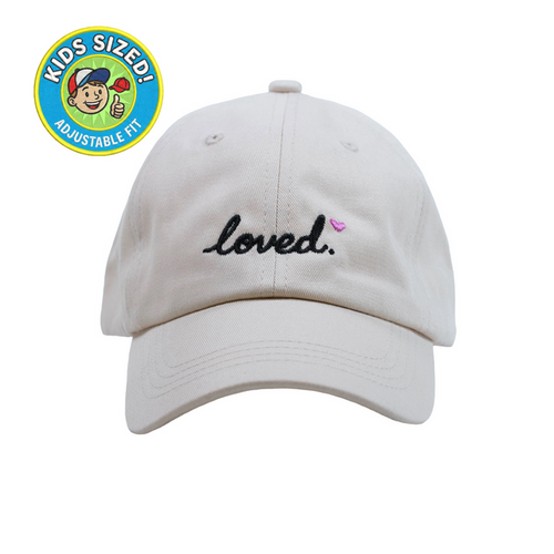Loved Kid’s Hat – Light cream embroidered kids cap with “Loved” text. A cute keepsake gift for children from Dad Brand.