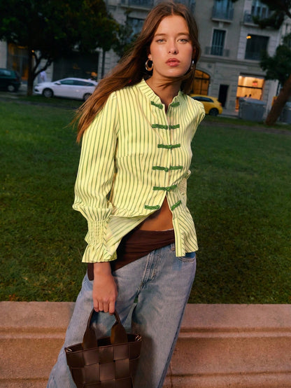 Nöista Striped Blouse With An Elegant Mandarin Collar, A Fitted Peplum Silhouette And Stylish Ruched Cuffs, Offering Refined Feminine