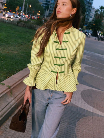 Nöista Striped Blouse With An Elegant Mandarin Collar, A Fitted Peplum Silhouette And Stylish Ruched Cuffs, Offering Refined Feminine