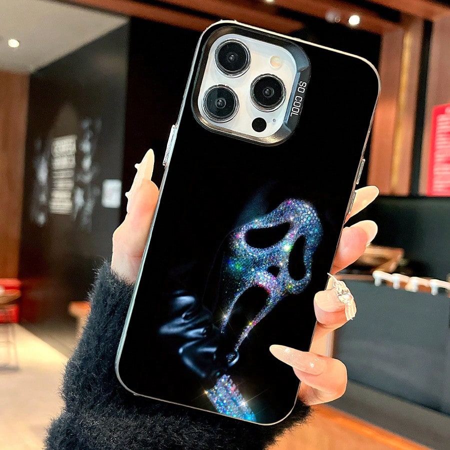 Sparkling Ghost Face Mobile Phone Case Designed With Rhinestones And A Sleek Black Finish Suitable For IPhone 16 15 14 13 12 And 11 Pro Models Made Of TPU Material And Provides Shockproof Protection.