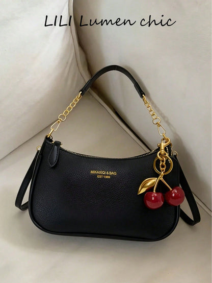 This Fashionable Shoulder Bag Features A Classic Letter Pattern And Pearl Cherry Pendant Decoration. Made Of Solid-Color Waterproof PU Material, It Can Be Used As A Shoulder Bag, Underarm Bag, Crescen