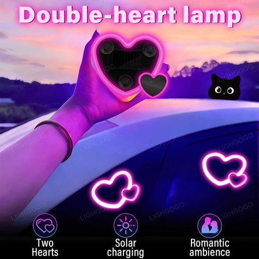 This Is A Pink, Heart-Shaped Car Ambient Light, Featuring A Double-Heart Design, Solar Power And USB Charging Capabilities, And Multiple Lighting Modes. It's Perfect For Dashboard Decoration And Inter